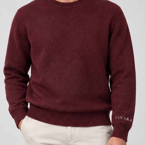 The ribbed crew collar at the neck.
