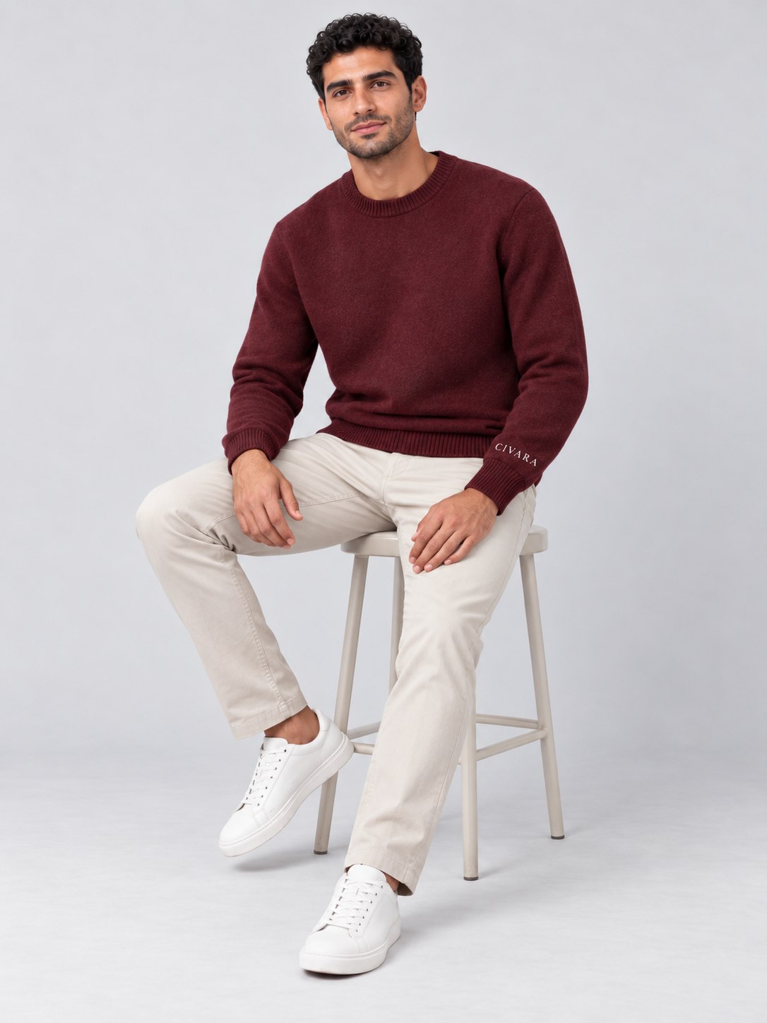The Sceptre Crew worn seated, with cream chinos.